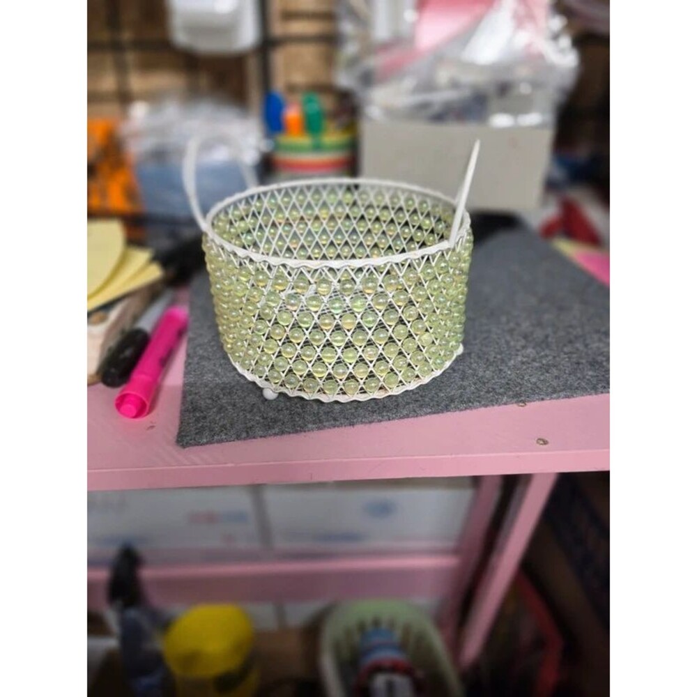 Metal basket with iridescent beads all around